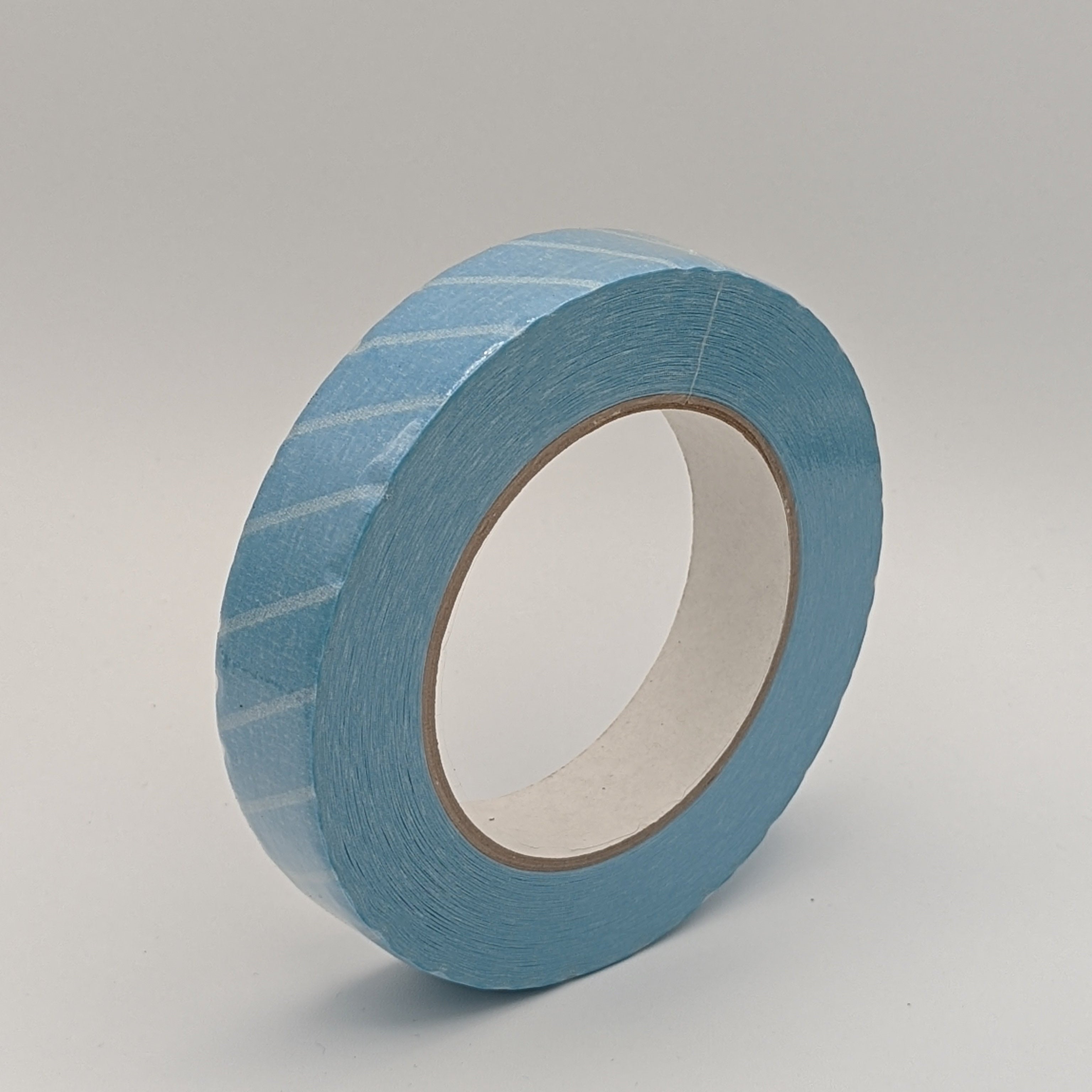 Blue and white stripped autoclave temperature triggering tape